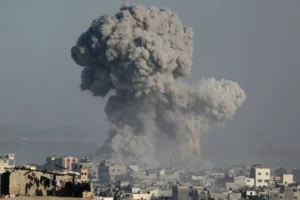 Destroyed buildings and rising smoke in Gaza following intense Israel airstrikes amid ongoing conflict.