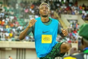 Victor Osimhen wearing sportswear on the pitch during a training session.