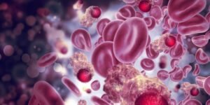 A healthcare worker explains sickle cell disease and treatment options to a patient, with World Health Organisation.