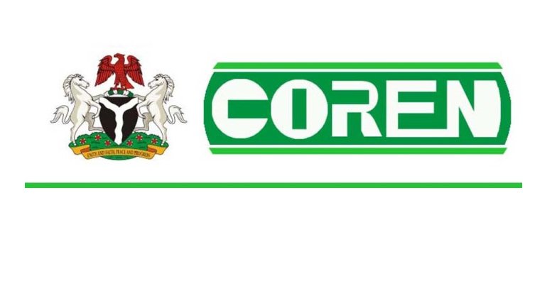COREN COREN logo displayed at an official event with the council's banner in the background