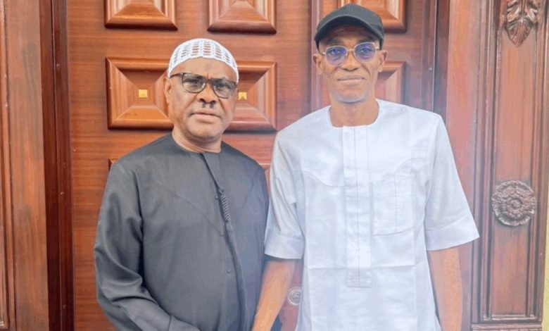 FCT minister FCT Minister Nyesom Wike stands with Labour Party leader Julius Abure during a private visit in Abuja.