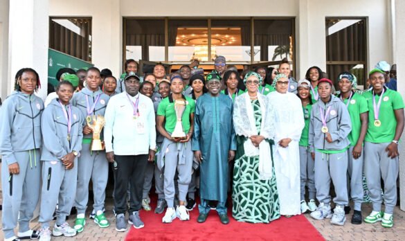 President President Bola Tinubu poses with the victorious Super Falcons team and officials during a reception at the Presidential Villa.