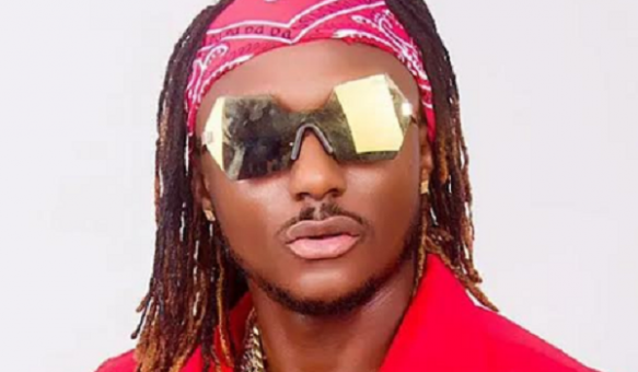 Terry-G Terry G wearing reflective sunglasses and a red bandana, dressed in a red outfit.