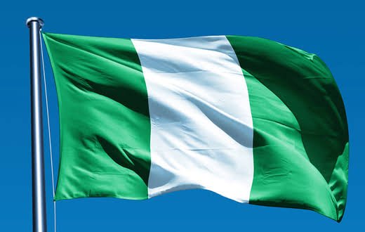 Nigeria flag Nigeria flag waving in the sky, symbolizing unity and strength of Nigeria