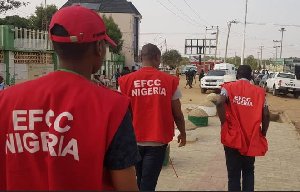 EFCC personel shot dead A scene of EFCC officers on duty, with a somber mood following the death of a colleague during an operation.