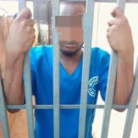 23-year-old boy named Charles being arrested by police after beating his mother during a heated argument over his girlfriend.