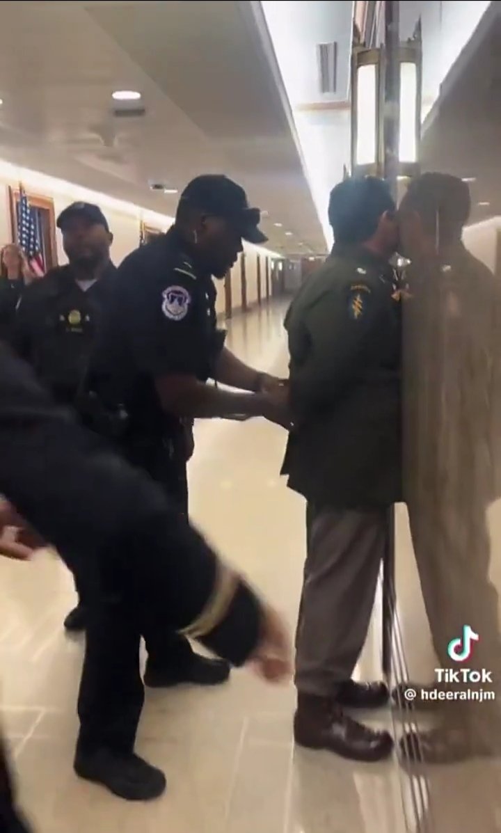 Pantangon American Air Force pilots in handcuffs inside a military facility after refusing orders to fly warplanes to Israel.