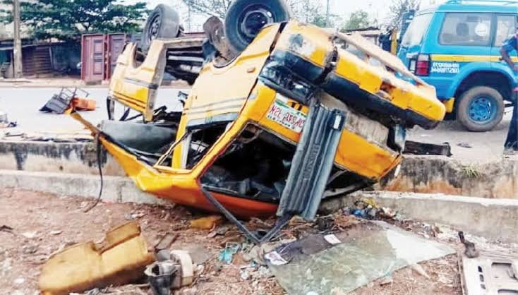 School bus accident A school bus accident scene in Benue State where 12 children tragically lost their lives, with grieving parents and community members gathered in tears.