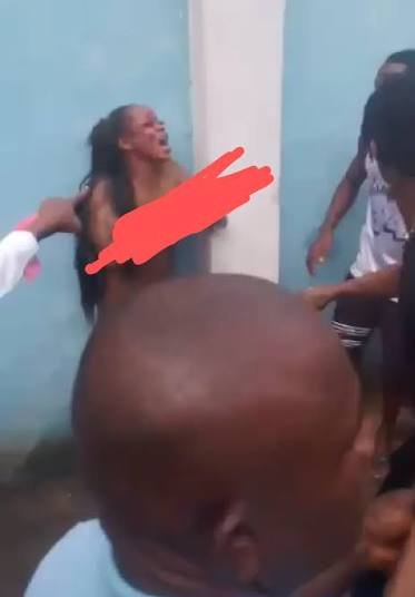 Lady goes naked A young woman standing naked on a street, crying and shouting in anger after heartbreak.