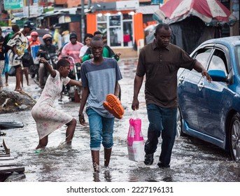 Lagos flood Woman in Lagos crying after floodwater destroys goods in her shop.