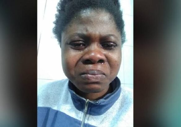 Young lady surrounded by neighbours as she is confronted in a viral video for allegedly poisoning her roommate to death.