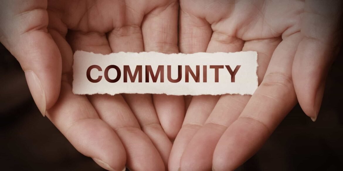 Community members sitting together in a neighborhood setting, showing unity, shared culture, and human connection that is slowly fading in modern society.